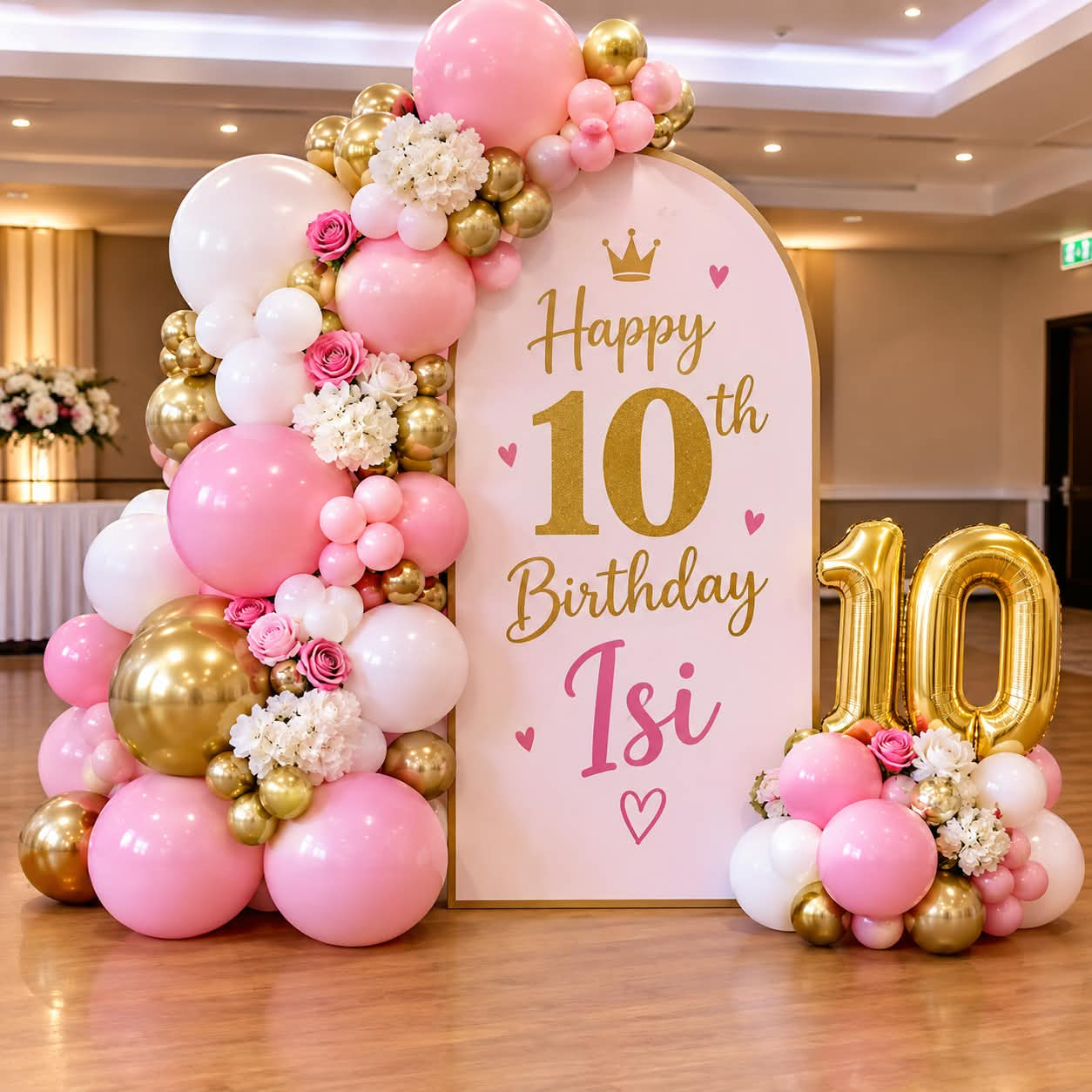 Pink, white and gold balloon installation for a tenth birthday celebration