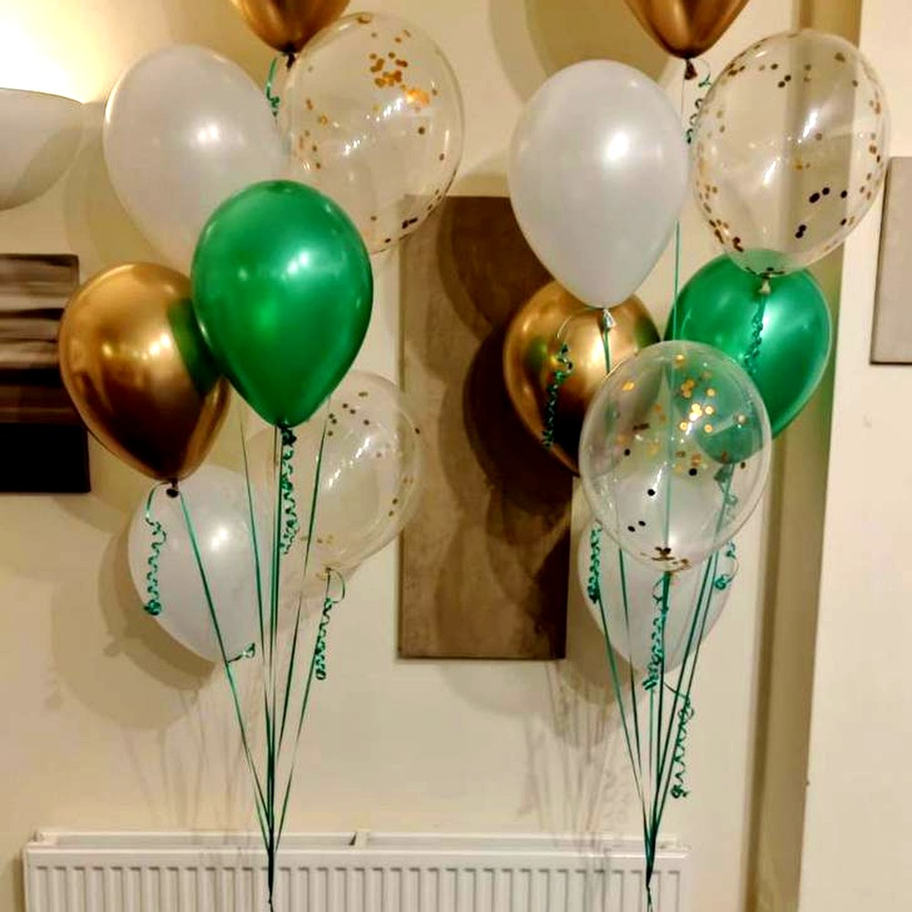 Two green, gold and white helium balloon bouquets